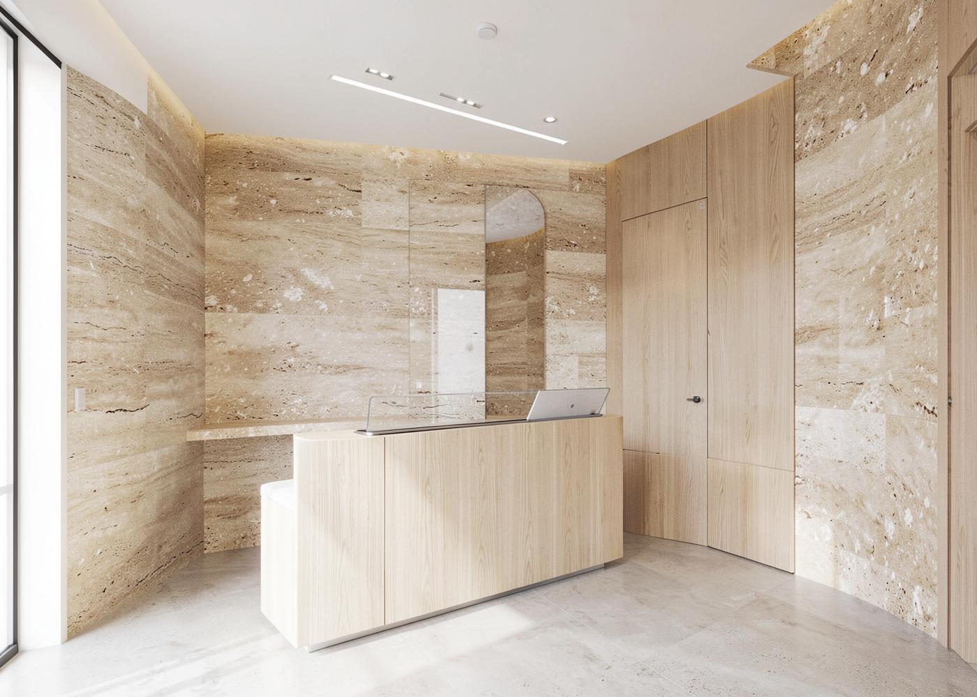 Minimal clinical reception interior in stone and pale timber
